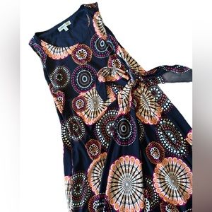 Fairly new beautiful slip over dress lightly used ties at the waist